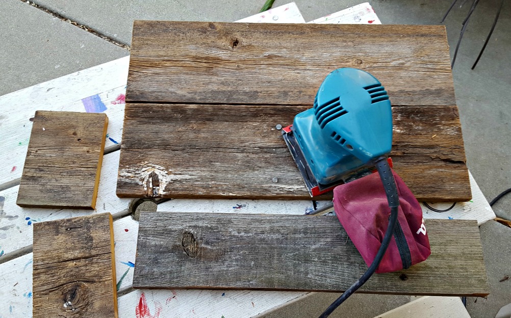 sanding fence wood to make a wooden box