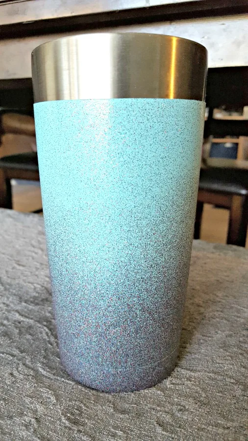 spray painting a stainless steel mug