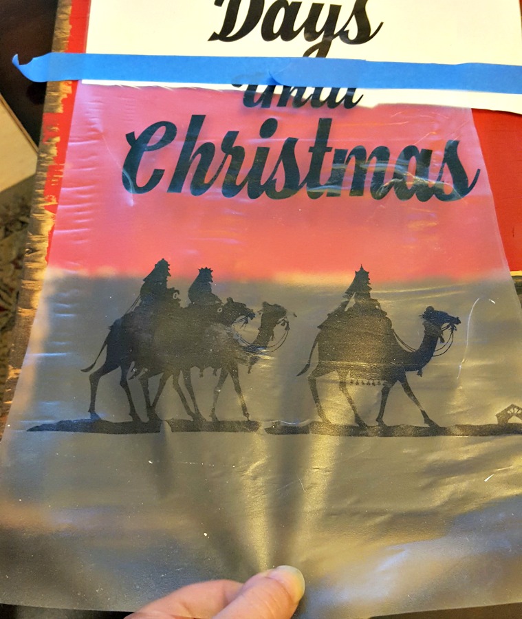 applying vinyl Christmas stencil