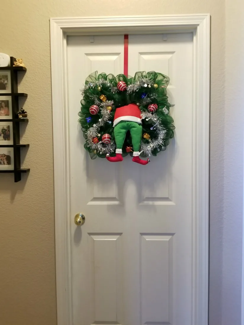 Grinch sticking out of tree Christmas Wreath