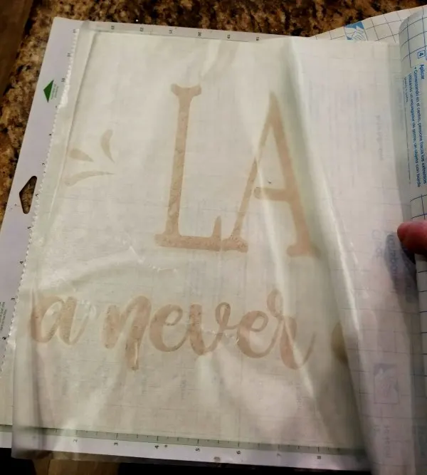 applying contact paper to use as transfer tape