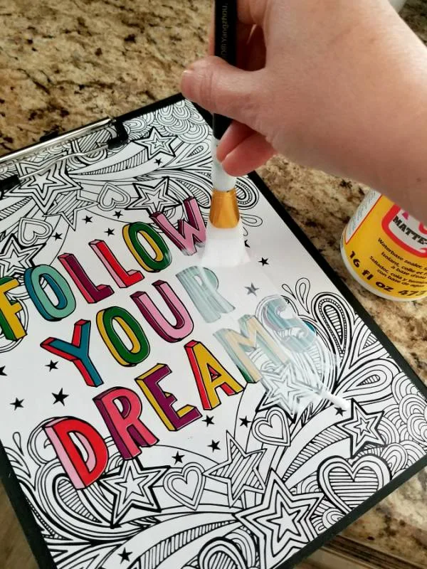 painting mod podge over personalized dollar tree clipboard
