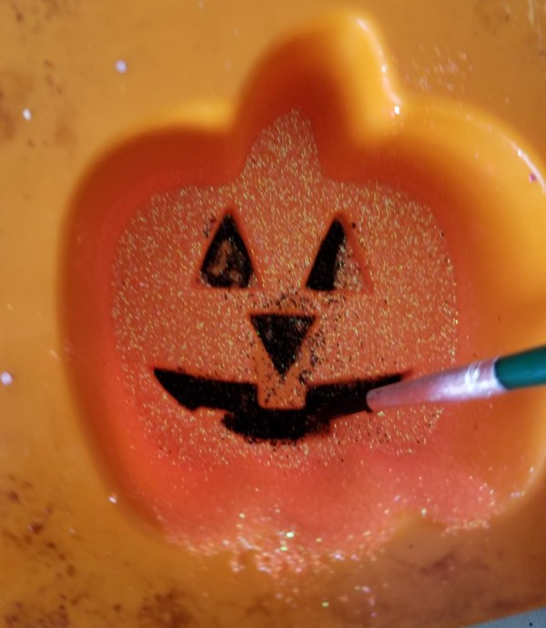 making jack o lantern mouth and nose black with glitter