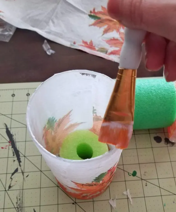 sealing the top of a decoupaged glass vase