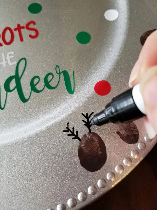 painting reindeer antlers on thumbprint