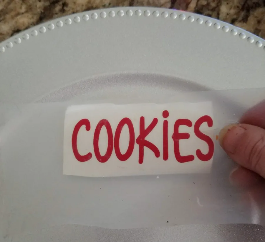 applying cookies vinyl decal to plate