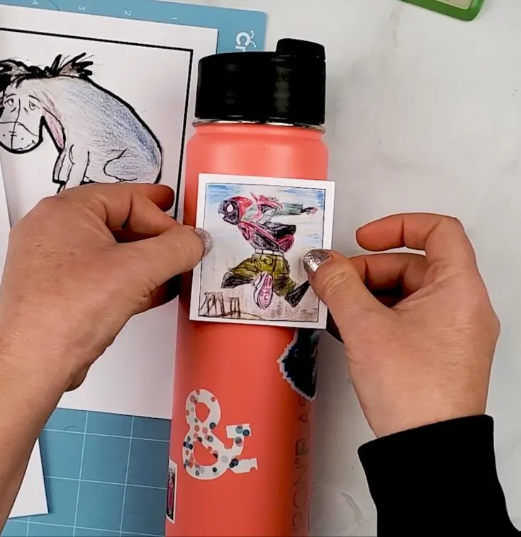 applying stickers to tumbler
